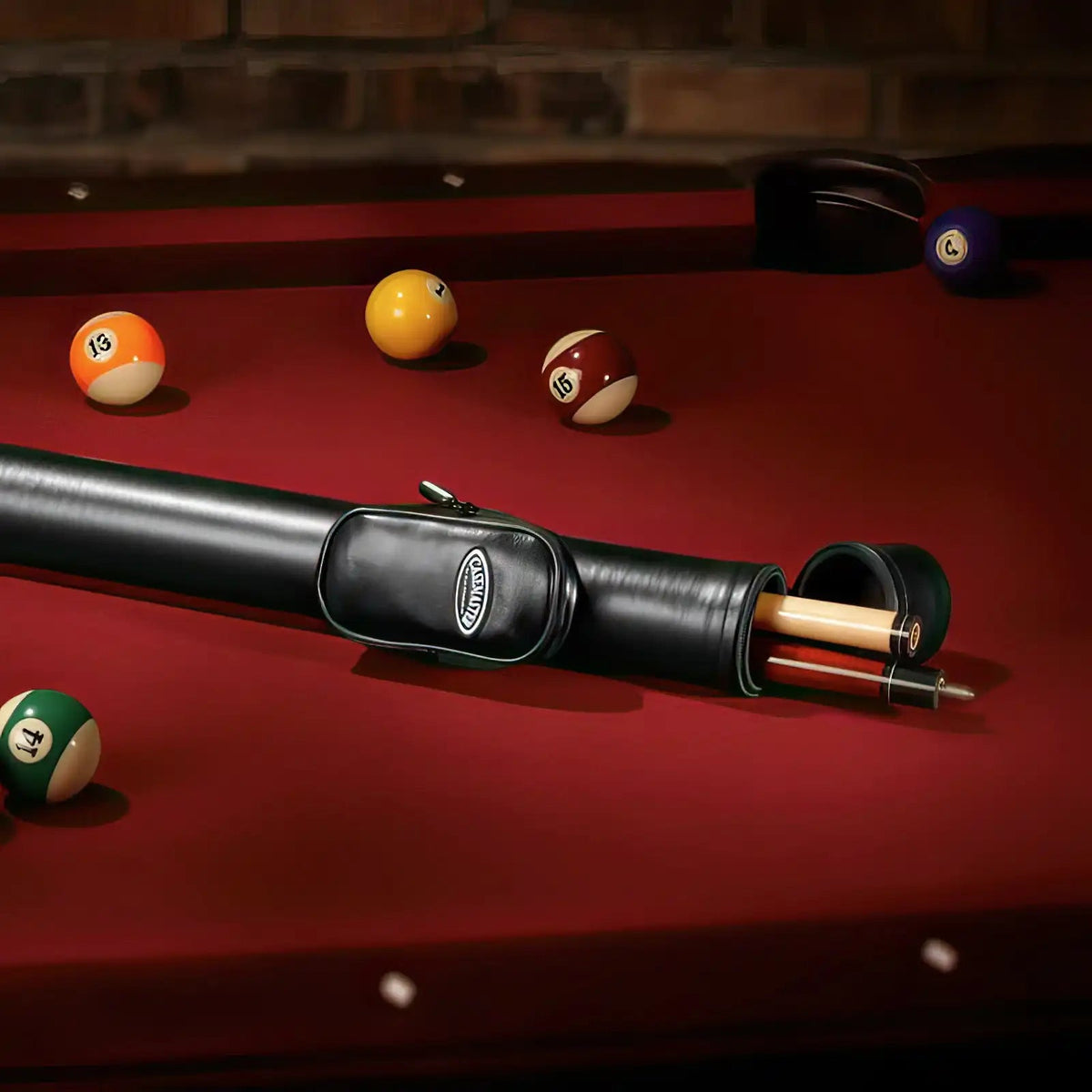 Casemaster Q-Vault Supreme Black Cue Case on a billiard table