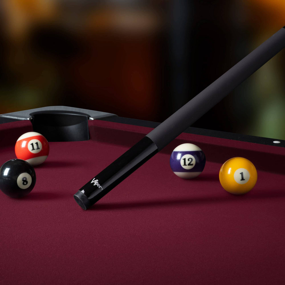 Viper Black Billiard Pool Cue Stick  on a billiard table